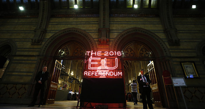 Security guards stand guard at the doors of the announcement hall in Manchester Town Hall , northwest England on June 23, 2016