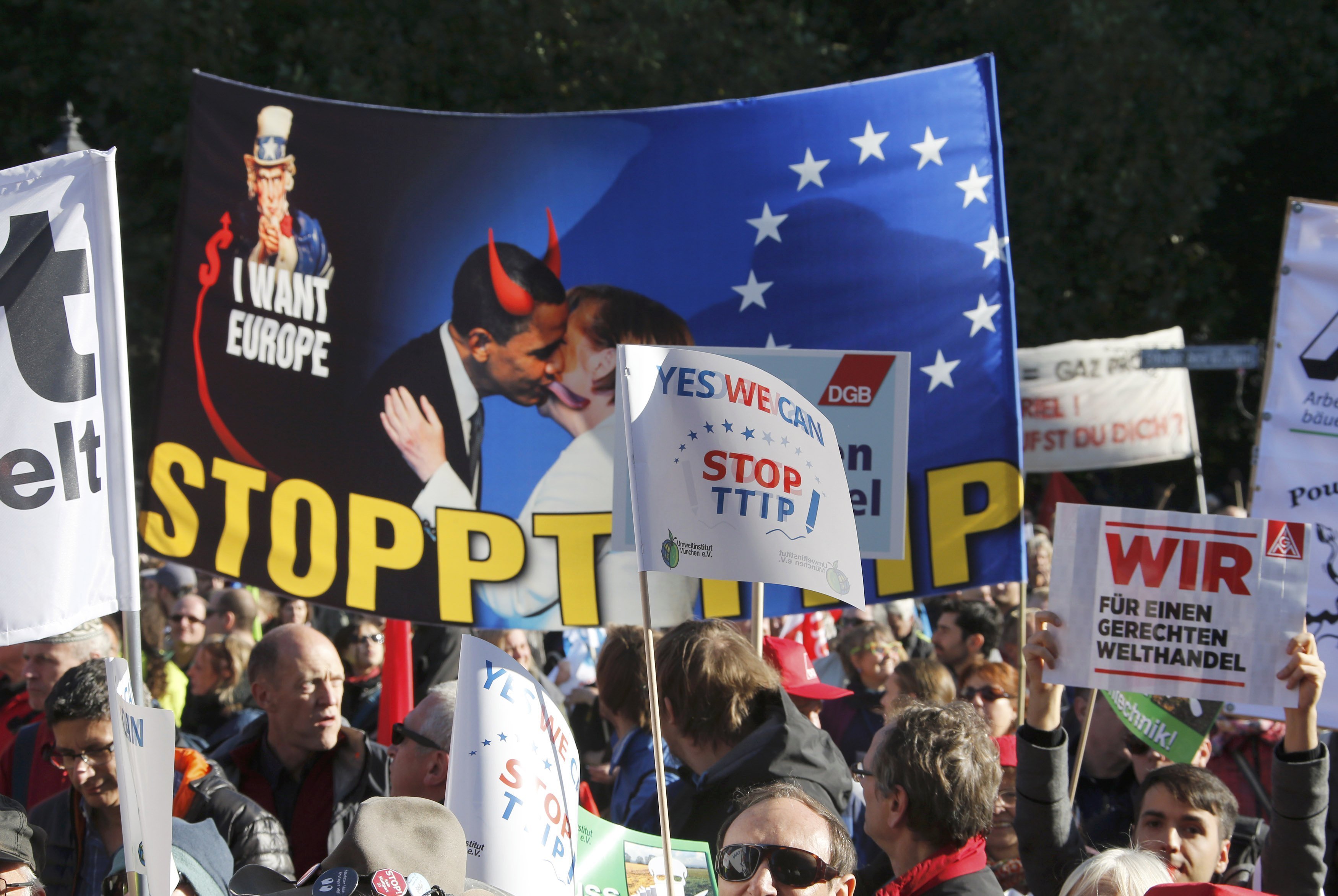 Consumer rights activists take part in a march to protest against the Transatlantic Trade and Investment Partnership (TTIP), mass husbandry and genetic engineering, in Berlin, Germany, October 10, 2015